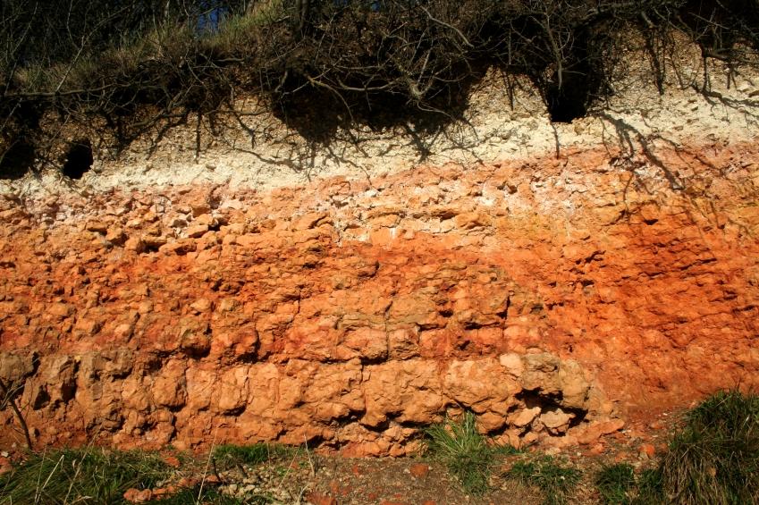 Soil parent material and weathering The mineral material of a soil is the product of the weathering of underlying rock in place, or the weathering of transported sediments or rock fragments.
