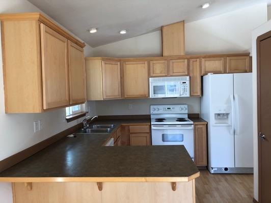 1. Kitchen Room Kitchen Walls and ceilings appear in good condition overall. Flooring is Engineered wood. Accessible outlets operate.