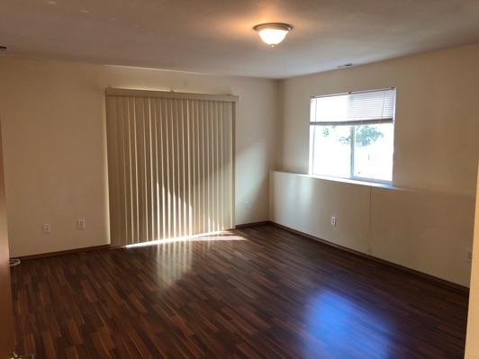 1. Location Location East Basement Family Room 2. Family Room Walls and ceilings appear in good condition overall. Flooring is engineered wood material in good condition.