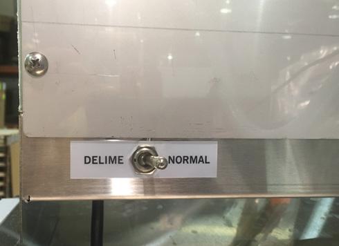 Flip the NORMAL/DELIME switch on the back of the control box to DELIME. 7. Run machine the period of time recommended by chemical supplier. 8.