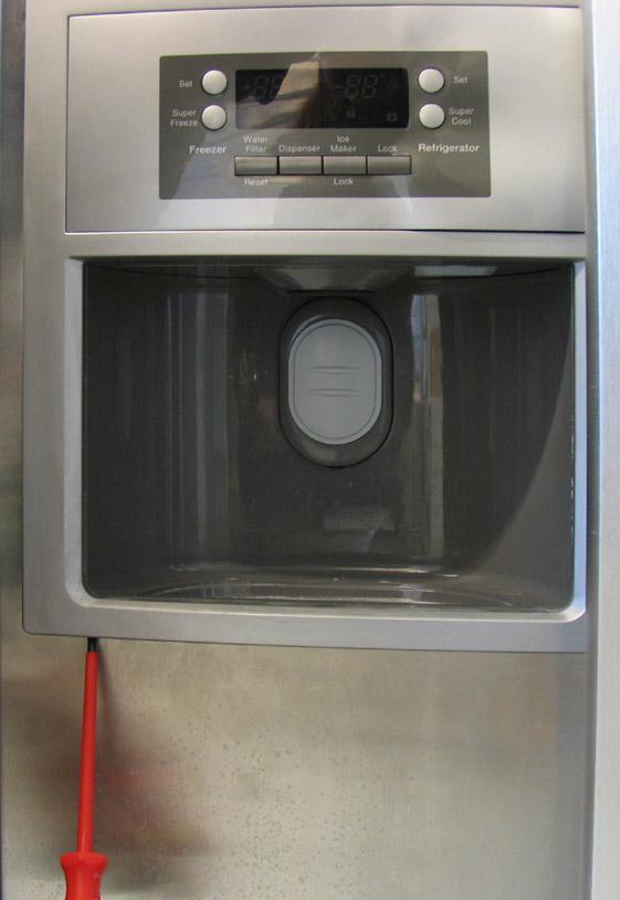 6.9 Ice dispenser Using a screwdriver with a flat blade, prise