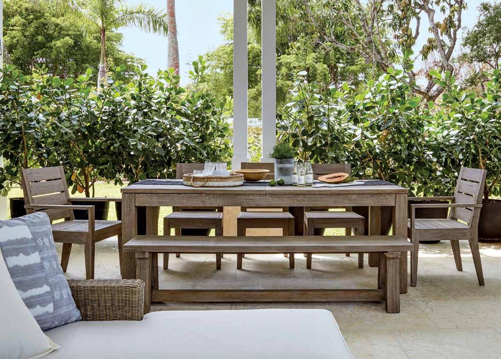 Above: Thanks to landscape designer AJ Morales, potted plants lend privacy to the outdoor dining area until the perimeter plantings reach maturity.