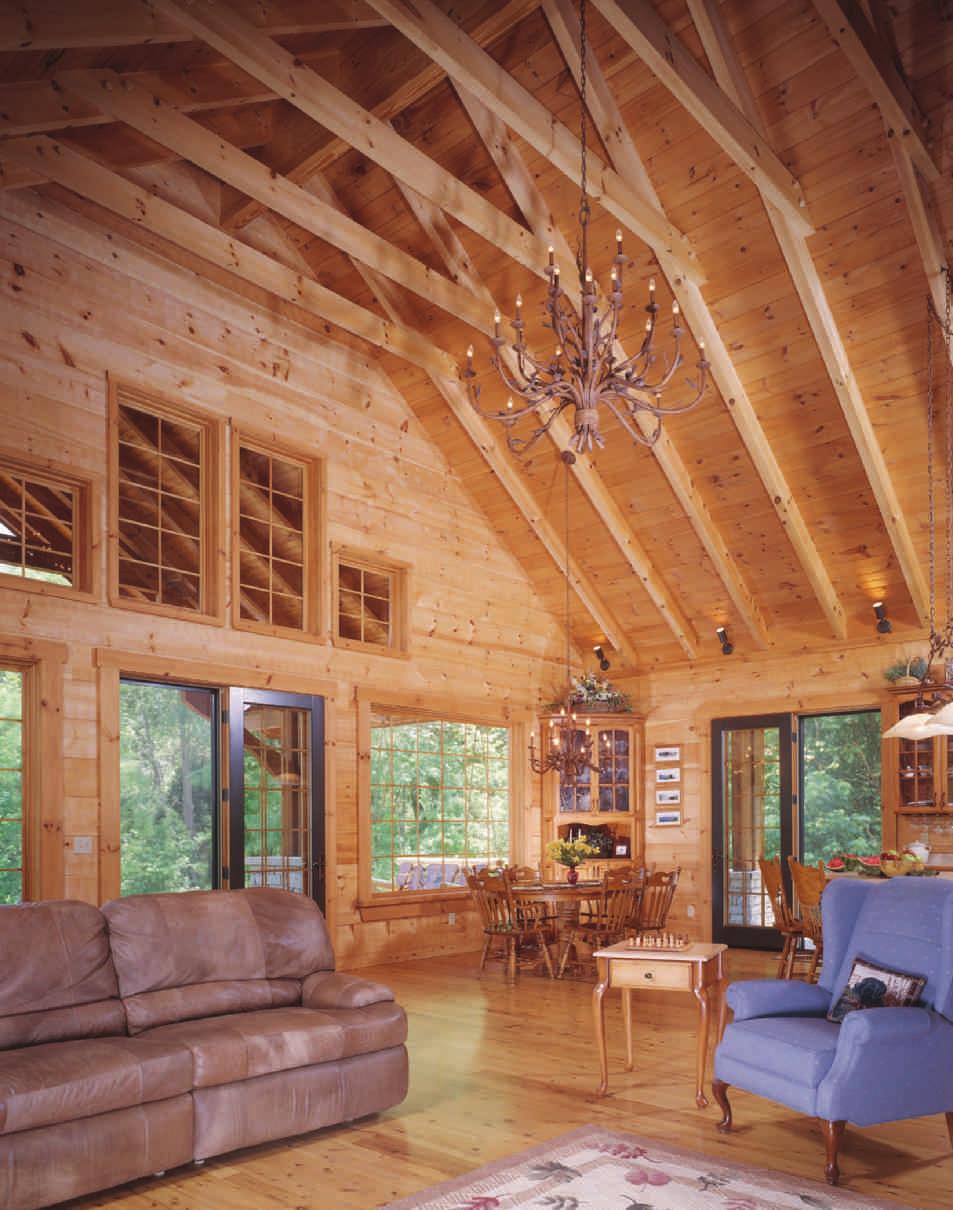 The great room is surrounded by craftsmen-style windows and overlooks the woods and waterways.