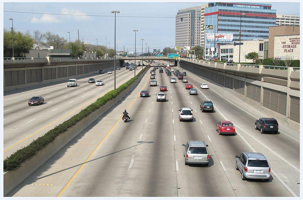 Frontage roads cantilevered over roadway to reduce impact Example of