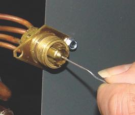 WARNING protected from overheating during brazing. The sensing bulb and TXV body must be covered using a quench cloth or wet cloth when brazing.