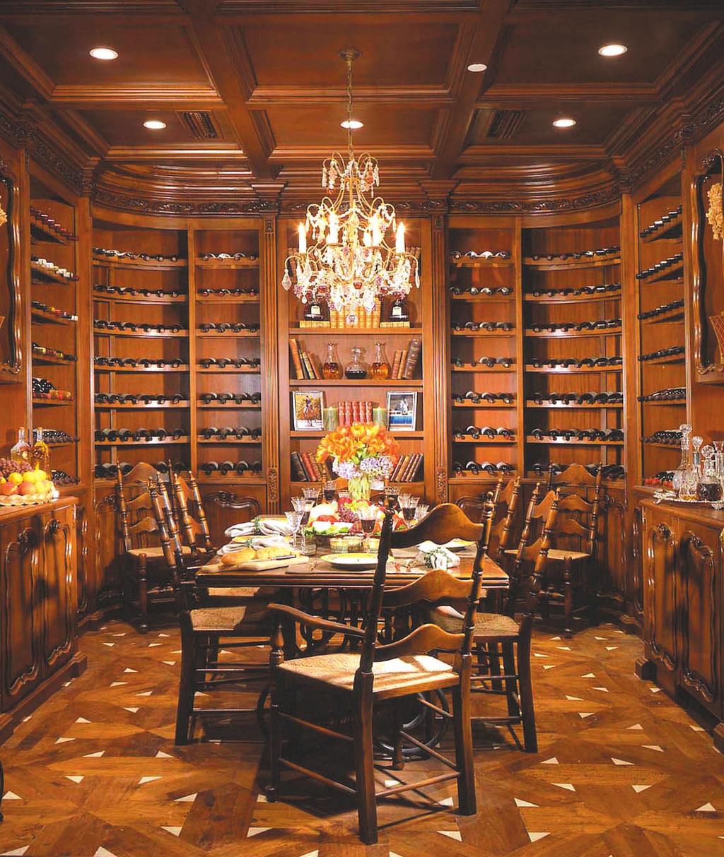 The wine-tasting room with the gorgeous cabinetry was designed to fit 12,500 bottles that is reminiscent of the baronial mood, states the designer.