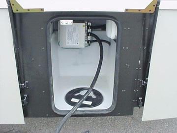 When the power cord is connected to an outside power source, or when the generator is in operation, the power converter automatically changes a portion of the 110-volt current to 12-volt DC current.