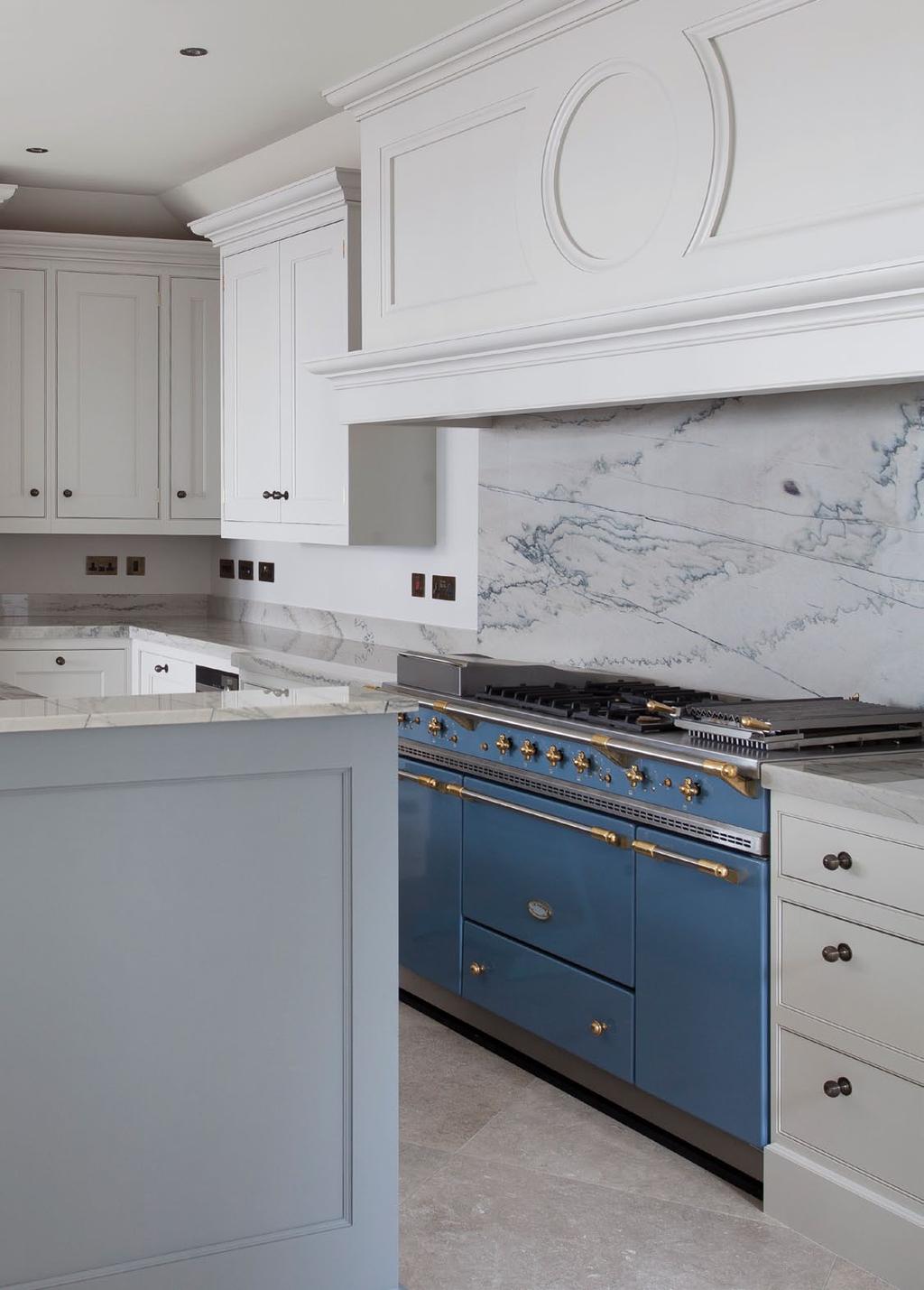 The muted tones continue to the custom crafted kitchen cabinerty.
