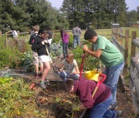 Students using tools in the garden. Compost piles in the garden going through the cooking stages. Instruct students using tools to stay an arm s length plus the tool length away from the next person.
