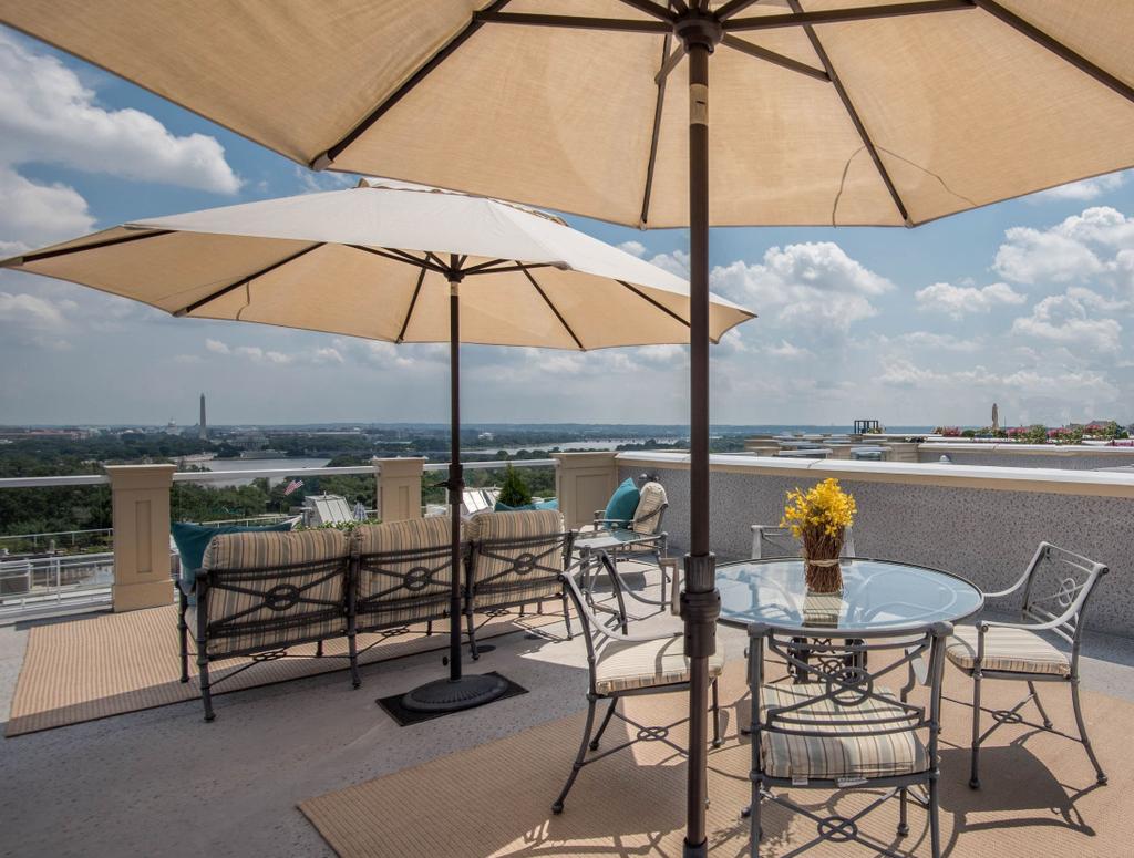 This impeccible townhome at 1415 N Nash Street is set within the pristine Bromptons at Monument Place community - known for its amazing views of Washington DC.