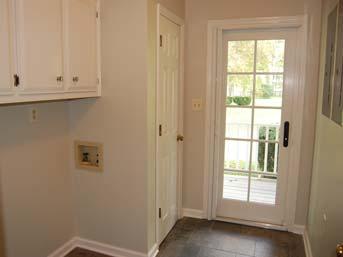 Hall: Hardwood floor, pantry closet, and half