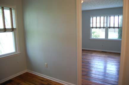 Family Room: Hardwood floor, closet, fireplace with raised brick