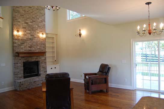 Great Room: Hardwood floor, chandelier, fireplace with brick hearth and gas
