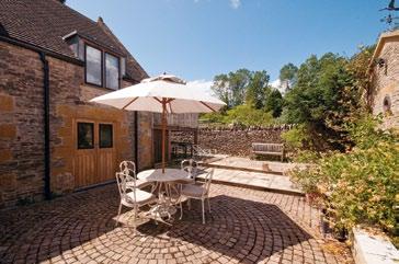 the wild garden. Terraces outside the house provide the ideal area for al fresco dining. There is also an area of woodland and in all the property sits in about 1.