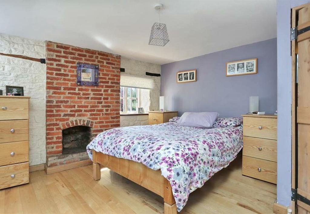 89m) With window to the front and side aspect, single radiator and exposed brick fireplace. BEDROOM TWO 13'03 x 10'10 (4.04m x 3.