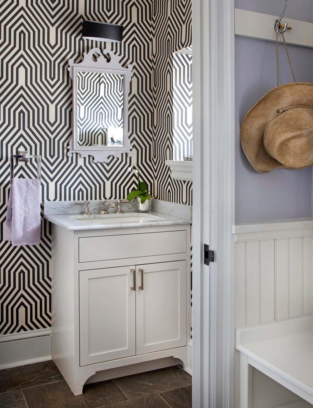 210 Powder room A bold geometric wallpaper from Osborne & Little makes this small powder