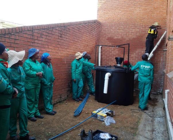 Installing the biogas digester Pictures Below: The team was actively involved in