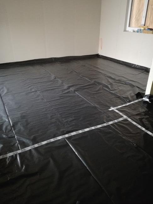 Place the moisture barrier foil on the whole surface of the room, putting a bit of it on the bottom of the wall above the height of the planned concrete screed.
