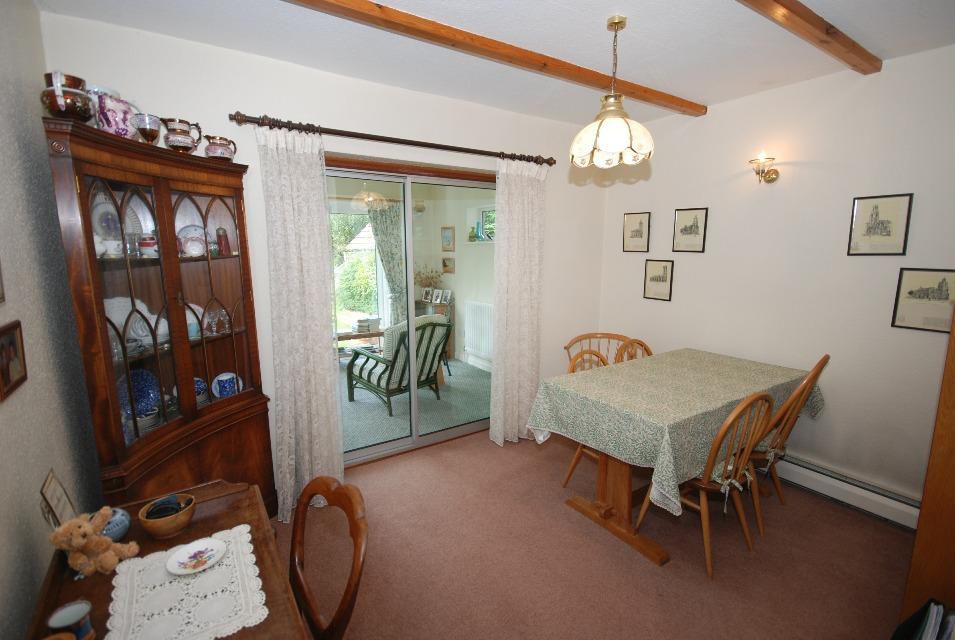 The accommodation is spacious with a large entrance hall, dining area, kitchen/breakfast room, sitting room, snug, garden room, utility room and cloakroom.