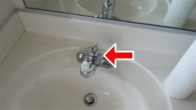 2 Item 2(Picture) (4) master bathroom -The sinks control knob/stopper system is not working properly and or missing components.