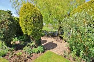 shrubs and hedge borders. The rear garden is simply stunning.