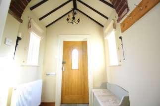 tiled flooring, feature brick archway and