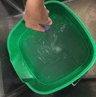 Mix a minimum of 2 gallons of foodgrade sanitizer in a bucket or container 4.