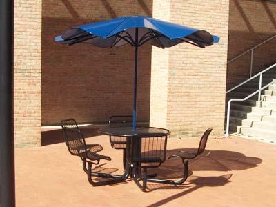 C. UMBRELLAS Consider umbrellas for shade wherever appropriate. Umbrellas must be permanently anchored to table.