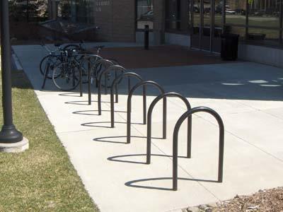 G. BIKE RACKS Select a bicycle rack or hoop style that complements other furnishings and is attractive within the campus environment. The design should be simple, space efficient and serviceable.