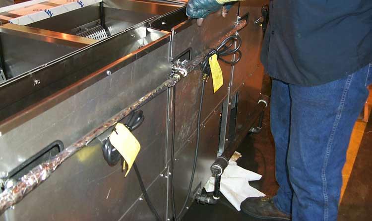 Uncrate fryers and remove from pallets by lifting up and over the pallet supports. Avoid damage to the casters and caster support bases when lifting and placing fryers.