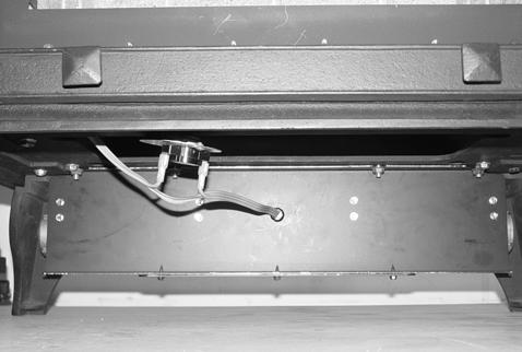 one in each of the mounting holes. Refer to Figure 7D above. Figure 7E 8. Place the temperature control switch (magnet attached) onto the bottom of the firebox as close to the center as possible.