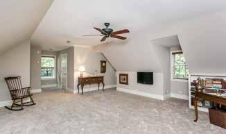 ROOM 24 0 X 16 0 Vaulted ceiling Ceramic tile floor Three walls of windows w/ transoms & glazed exit door Stacked stone gas fireplace on raised hearth w/wood mantel shelf