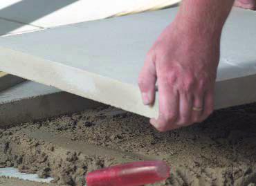 Establish bedding tracks with the screeding board. Bed the screen rails into the bedding sand.
