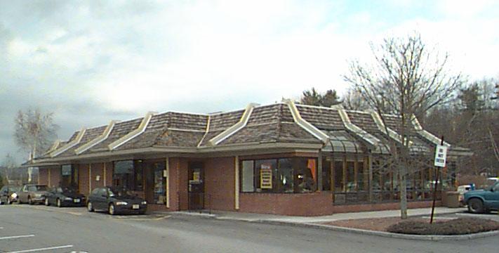 Franchise-style architecture, such as the fast-food restaurant at left, lacks reference to