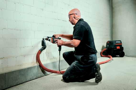 Dual suction chamber collects dust while allowing full suction to adhere to walls or