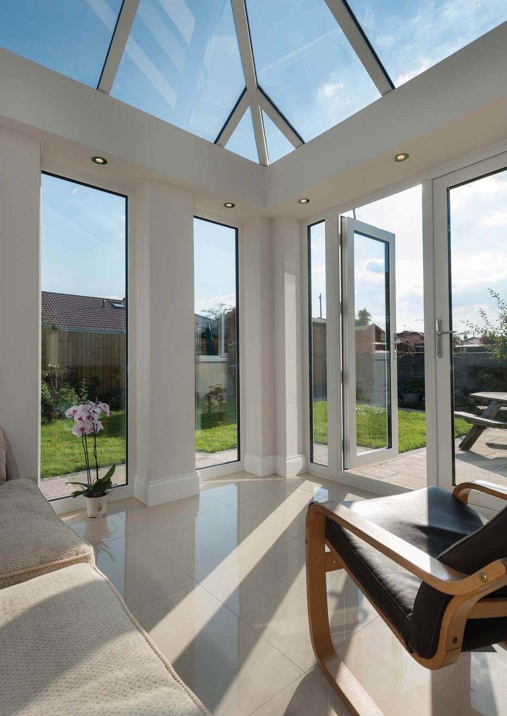 The UltraSky orangery system features a full glass roof, with a cornice externally and the plastered pelmet system internally.