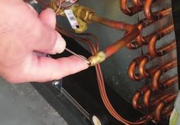 9. Connecting Refrigerant Lines 1. Release nitrogen holding charge by depressing the Shrader Valve at the liquid line connection on the air handler.