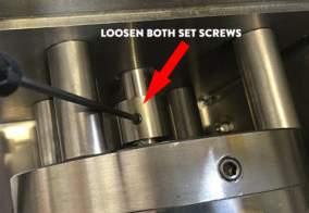 If the spacing is incorrect, loosen the set screws and adjust the