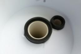 outside edge) over the water hose so that it rests on top of the ball bearings (photo on left above).