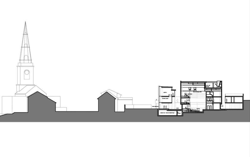 A cross section through the island of buildings indicates
