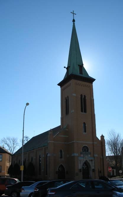 Trinity Lutheran Church (1893) on Saxton Street is an excellent example of a Gothic Revival style church building with varied buttressed towers and a compound arch portal entry. Photo 5.