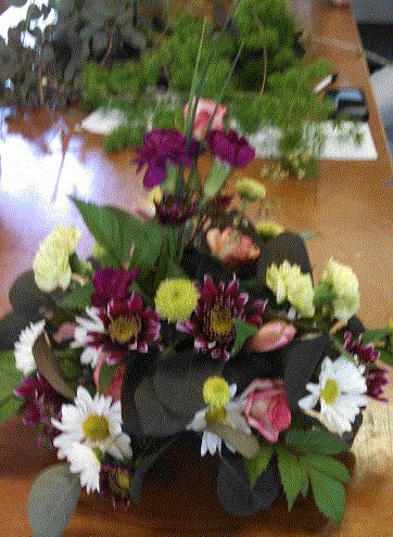 and flowers to use, and arranging the flowers and plants attractively.