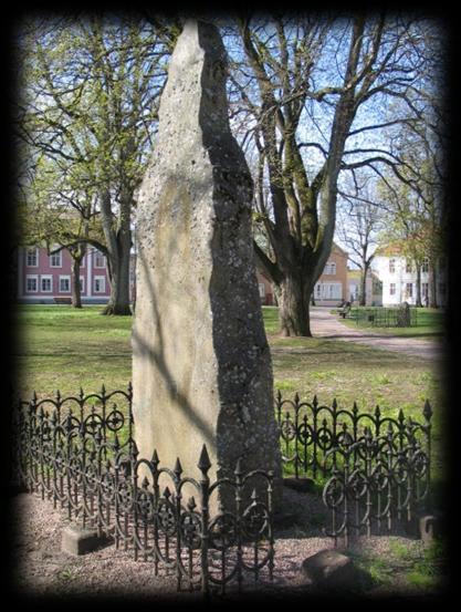 Graves and monuments - focus with a mysterious atmosphere light In the park there are one prominent grave next to the Church the presumed grave of the famous explorer Jonas Ahlströmer that brought