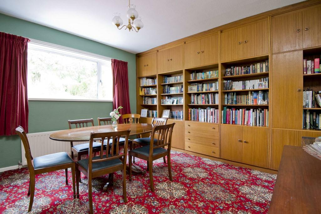 Original parquet floor under carpets. Bookshelves. French doors to rear garden.