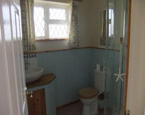 Page25 Bathroom Item Description Condition Check Out Ceiling -Flat white painted ceiling Walls -Cream painted top half of walls and blue painted wooden cladding on bottom half -White tiles with