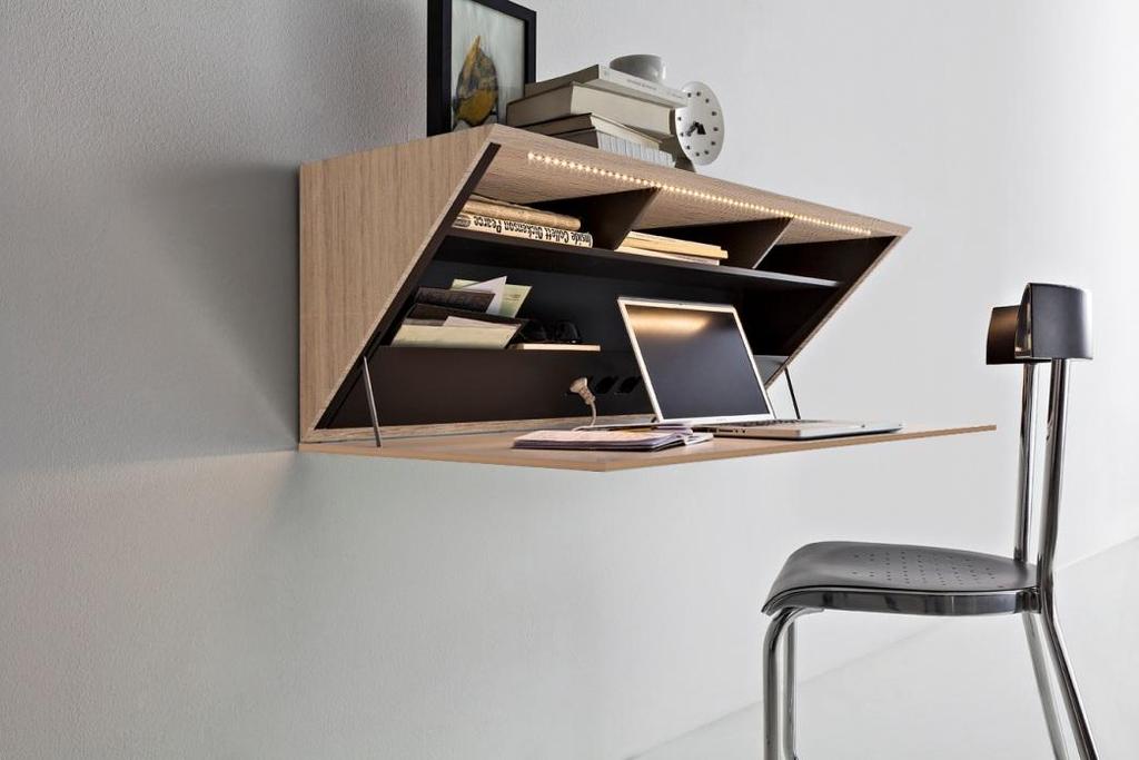 Segreto Ron Gilad The elements dimensions are small in order to occupy the minimum space when not in use. The writing desk element, when the door is open, offers a cosy and wide display shelf.