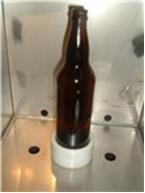 The base(s) must be in place to fill glass bottles, do not place a bottle directly on the metal.