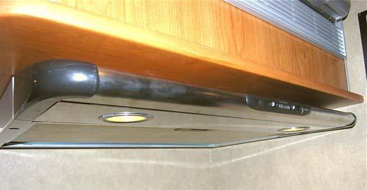 SECTION 4 APPLIANCES AND SYSTEMS RANGE HOOD -If Equipped The range hood vent draws cooking odors and airborne grease particles into the filtration grid and either recirculates the air or vents it to