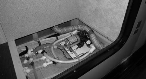 SECTION 7 PLUMBING Water Pump (Located beneath removable access panel in passenger rear compartment) -Model 24M shown COLD WATER FILTER If Equipped To obtain filtered cold water for drinking or