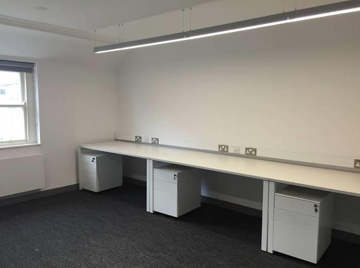 Study space to third floor with contemporary lighting and neutral decor Tuck pointint carried out to red
